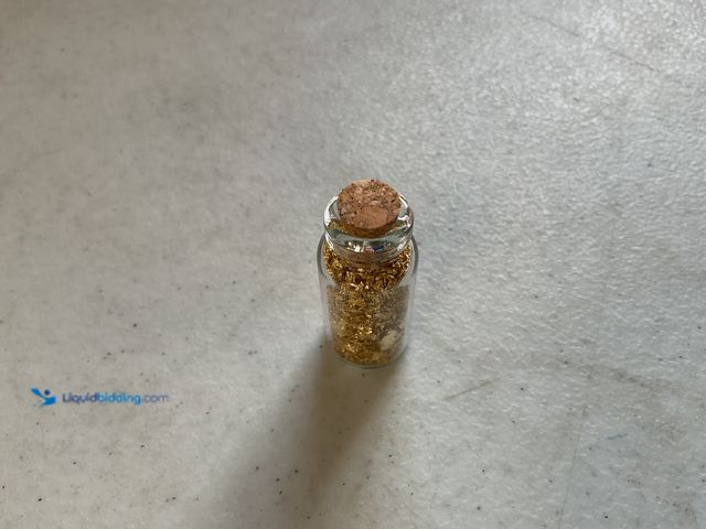 Lot 49-3503561 - RARE ONE INCH GLASS VILE OF PURE 24K GOLD FLAKES