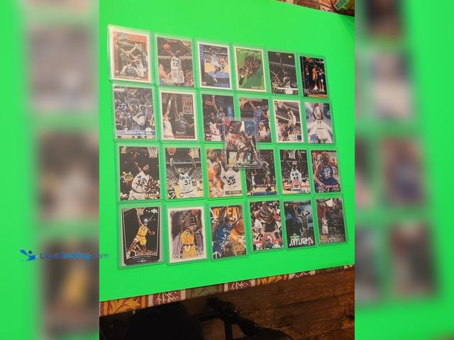 Lot 49-1913854 - 25- COLLECTIBLE SHAQUILLE ONEAL NBA BASKETBALL CARDS. VARIOUS BRANDS AND YEARS PRODUCED. INCLUDES EL...