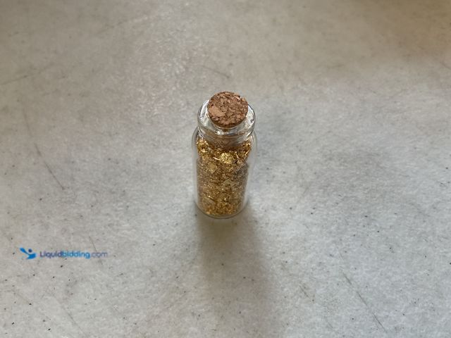 Lot 49-5515054 - RARE ONE INCH GLASS VILE OF PURE 24K GOLD FLAKES