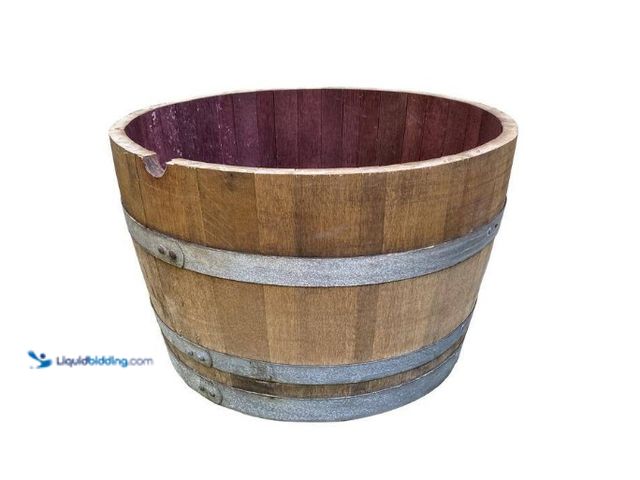 Lot 49-5552691 - Jack Daniels 27.5 in. Wood Oak Wine Barrel Planter. Model # OWBP. Unused and dirty/rusty.