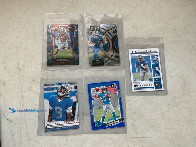 Lot 49-1830513 - COLLECTIBLE LOT OF 4 DETROIT LIONS ROOKIE FOOTBALL CARDS INCLUDING JAHMYR GIBBS, JAMESON WILLIAMS, H...