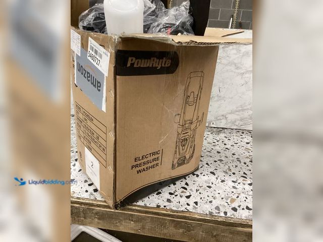 Lot 49-5460727 - PowRyte Pressure Washer P2GB5LB4 Item is used with hardware and attachments powers on.