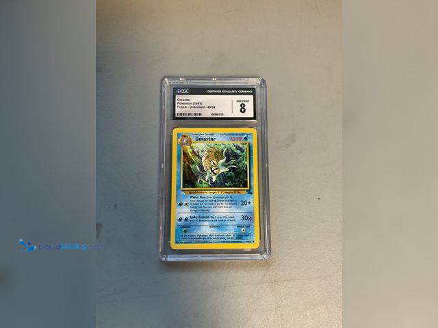 Lot 49-1811389 - COLLECTIBLE GRADED CARD! OMASTAR FOSSIL 40/62 CGC 8 NM/MINT