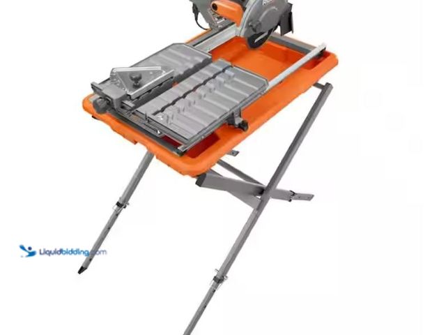 Lot 49-1632158 - RIDGID 9-Amp 7 in. Blade Corded Wet Tile Saw with Stand, Model # R4031S, Used, Has some attachments,...