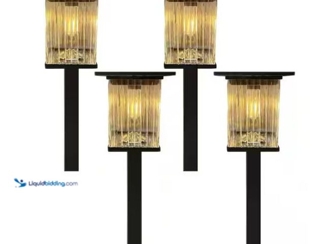 Lot 49-1627502 - Monteaux Lighting Black Integrated LED Outdoor Solar Pathway Lights with Clear Ribbed Glass (4-Pack)...