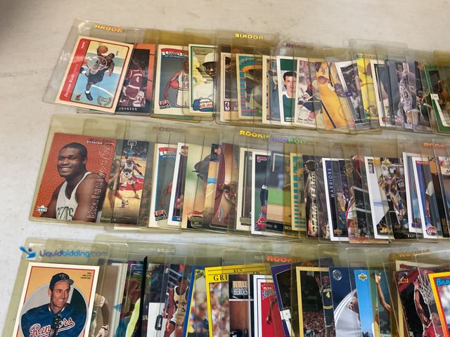 Lot 49-1505586 - COLLECTIBLE TABLE LOT OF BETTER SPORT CARDS FROM DIFFERENT YEARS AND TYPES MOST IN HARD TOP LOADS IN...