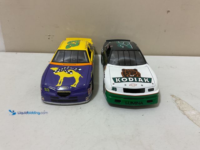 Lot 49-1835347 - Other WOW AN AMAZING LOT OF 2 NASCAR 1:18 SCALE STOCK CARS INCLUDING #23 JIMMY SPENCER CAMEL FORD TH...