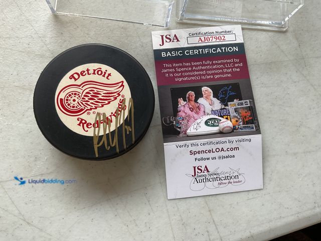 Lot 49-1830626 - COLLECTIBLE DETROIT RED WINGS LEGEND PAUL COFFEY AUTOGRAPHED HOCKEY PUCK WITH JSA COA #CONS0219