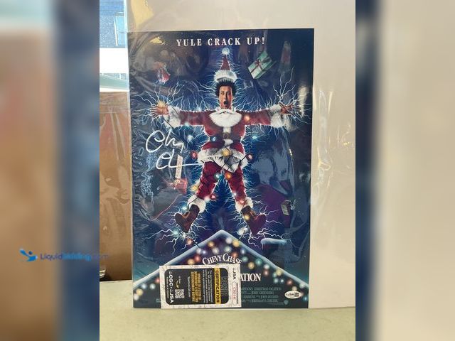Lot 49-1977837 - Other VERY NICE CHEVY CHASE NATIONAL LAMPOONS CHRISTMAS VACATION AUTOGRAPHED PRINT POSTER WITH JSA C...