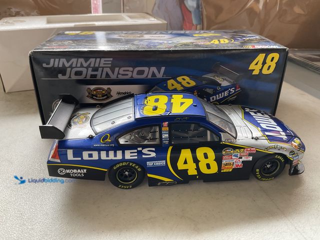 Lot 49-1830611 - COLLECTIBLE ACTION RACING #48 JIMMIE JOHNSON LOWE’S 1/24 SCALE DIECAST CAR IN ORIGINAL BOX #COINS021...