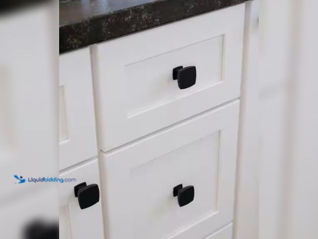 Lot 49-1549419 - (12x) Liberty Webber 1-3/8 in. (35 mm) Classic Matte Black Square Cabinet Knob, Model # P35051C-FB-C...