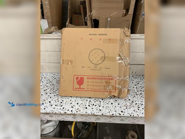 Lot 49-5462017 - Medium size Black round mirror. Unused but has shipping damage. Frame is slightly bent.