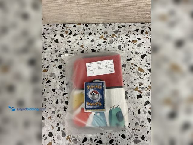 Lot 49-3538925 - Osznmmg trading card binder Pokemon. Comes with mystery assorted Pokemon cards.