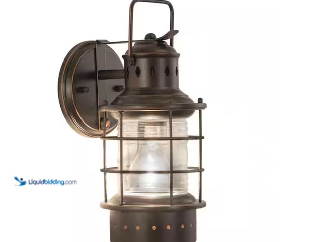 Lot 49-3613555 - VAXCEL Hyannis 1 Light Bronze Coastal Lantern Cylinder Outdoor Wall Lantern Clear Glass, Model # OW3...