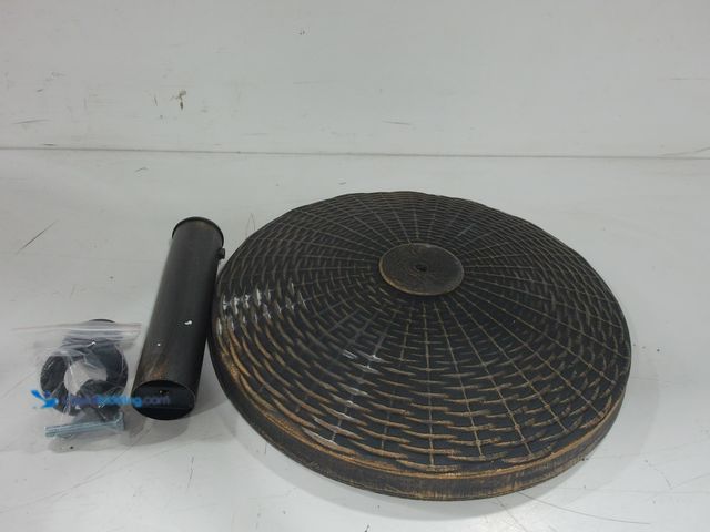 Lot 49-2026406 - resin patio umbrella base in black and bronze Slightly  used, has attachments. NOTE: Stains.