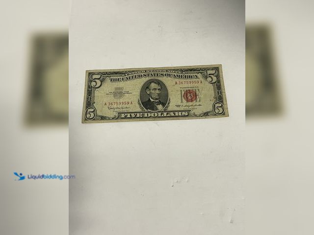 Lot 49-910571 - Series 1963 $5 United States Note featuring the classic red Treasury seal and serial numbers. This L...