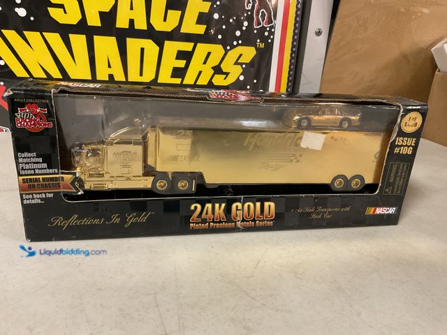 Lot 49-1505468 - COLLECTIBLE RACING CHAMPIONS 24K GOLD PLATED PRECIOUS METALS SERIES 1/64 SCALE TRANSPORTER WITH STOC...