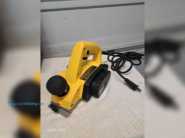 Lot 49-1804753 - DeWalt Electric Powered Hand planer DeWalt electric hand planer lightly used works great.