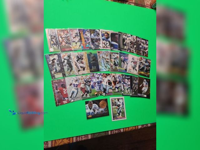 Lot 49-1913876 - 30- COLLECTIBLE EMMITT SMITH NFL FOOTBALL CARDS. VARIOUS BRANDS AND YEARS PRODUCED. ALL CARDS ARE IN...
