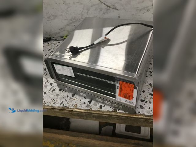 Lot 49-3536708 - NINJA
18.55 Qt. Flip Toaster Oven & Air Fryer, 8-in-1 Functionality Item is unused with scuffs, tes...