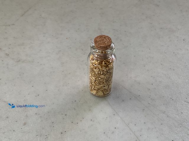 Lot 49-1810333 - ONE INCH GLASS VILE OF PURE 24K GOLD FLAKES