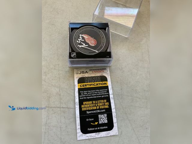 Lot 49-1977829 - Other DETROIT RED WINGS LEGEND PAVEL DATSYUK AUTOGRAPHED HOCKEY PUCK WITH JSA COA #COINS0723