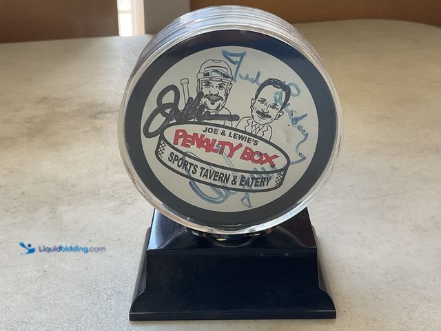 Lot 49-3609213 - Other AMAZING AUTOGRAPHED HOCKEY PUCK BY JOEY KOCUR, TED LINDSAY AND DAVE LEWIS
