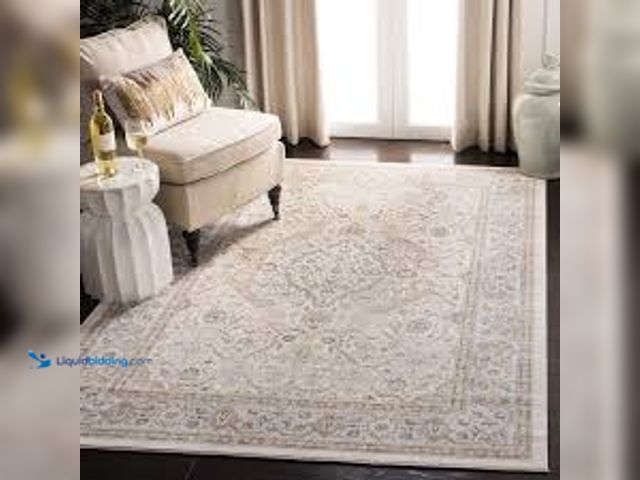Lot 49-5411932 - SAFAVIEH Isabella Cream/Beige 9 ft. x 12 ft. Floral Medallion Area Rug. Model # ISA916B-9. Unused