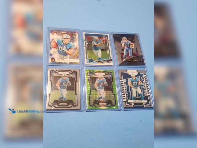 Lot 49-1817770 - 6- COLLECTIBLE SAM LAPORTA ROOKIE FOOTBALL CARDS. VARIOUS BRANDS INCLUDES NEON GREEN PRIZM REFRACTOR...
