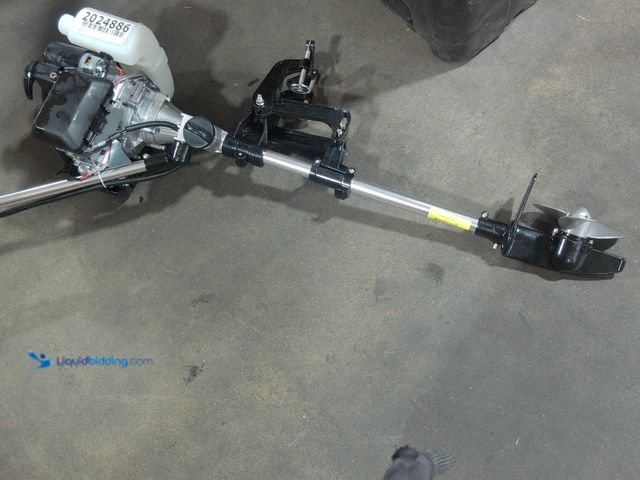 Lot 49-2024886 - 2 Stroke Trolling Motor,  Slightly used, has compression, scuffs and scratches, Missing Gas cap.  Re...