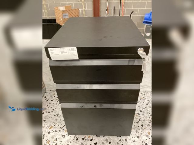 Lot 49-5414717 - 3 tier black metal  filing cabinet with lock and key 4 wheels Unused, has keys. Some scuffs/scratche...