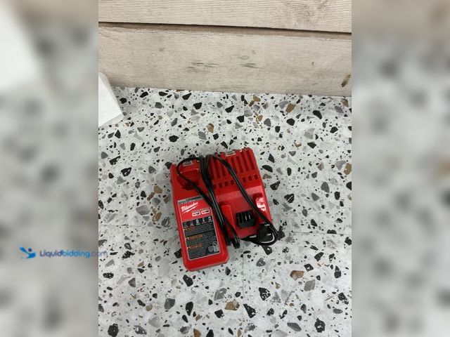 Lot 49-5485914 - Milwaukee M12 and M18 12-Volt/18-Volt Lithium-Ion Multi-Voltage Battery Charger. Model # 48-59-1812....