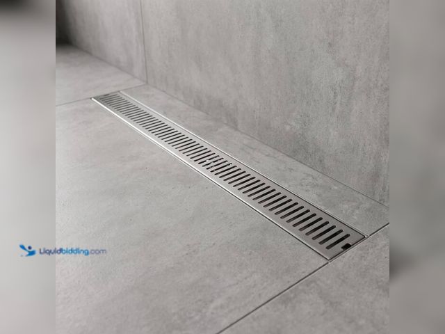 Lot 49-2024210 - VIGO Elan 24 in. Linear Shower Drain in Brushed Nickel. Model # VG07002BN. MSRP $90. Unused.   Ref#S...