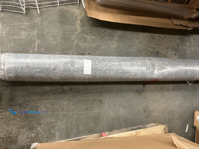 Lot 49-5445904 - 7'x10' Ivory Grey Indoor area rug, Unused. Dusty from storage.