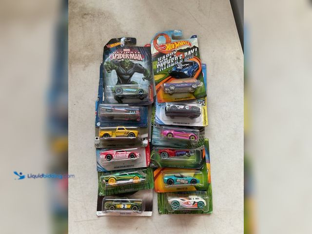 Lot 49-1505508 - COLLECTIBLE LOT OF 12 HOT WHEELS 1/64 SCALE DIECAST CARS IN ORIGINAL PACKAGES VARIOUS MAKES AND MODE...