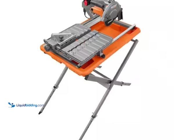 Lot 49-1575734 - RIDGID 9-Amp 7 in. Blade Corded Wet Tile Saw with Stand, Model # R4031S, Slightly used, Unable to te...
