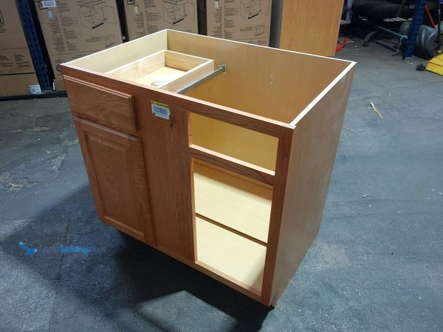 Lot 49-1533800 - Cabinet in brown oak. 39.5"x35" The bottom is scratched and is missing one door, Unused   Ref#HDPA09...
