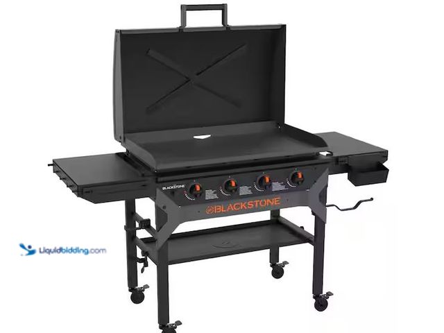 Lot 49-5551901 - Blackstone
4-Burner 36In Liquid Propane Outdoor Griddle with Hood in Black, Unused with attachments...