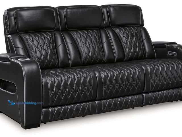Lot 49-3571617 - Signature Design by Ashley 3-Seater Leather Power Reclining Sofa, Black, Unused with hardware
