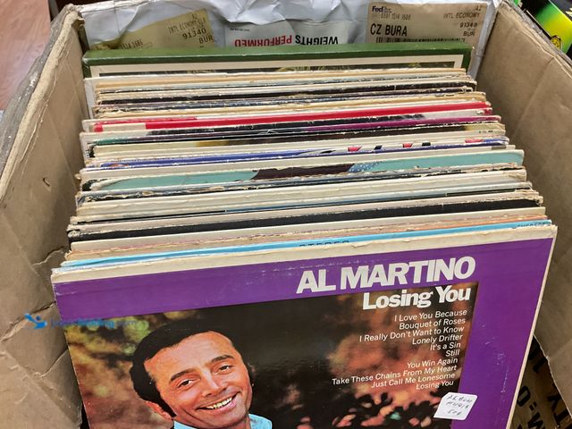 Lot 49-1810450 - COLLECTIBLE BOX FULL OF PRE-OWNED VINYL RECORDS FROM VARIOUS YEARS AND GENRES
