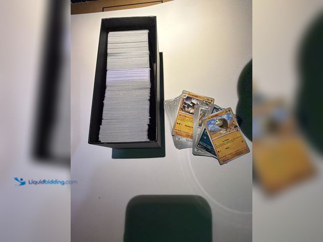 Lot 49-1831688 - Lot of 500+ bulk Pokemon cards one full etb box, various series.