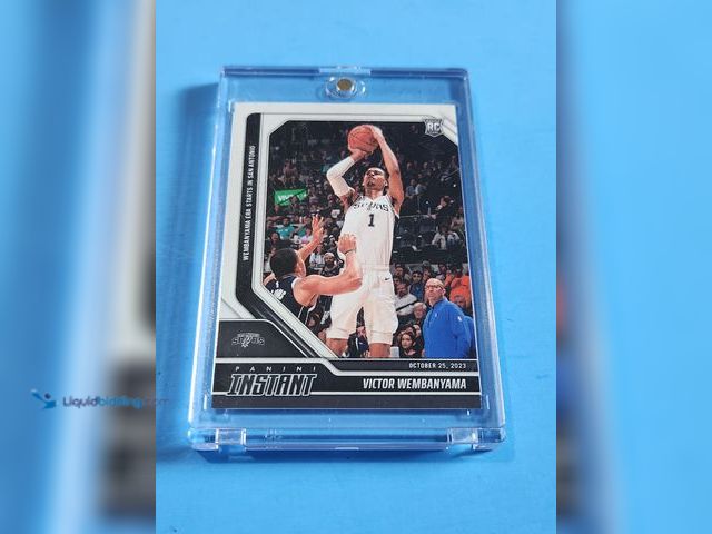 Lot 49-1817786 - 2023-24 PANINI INSTANT VICTOR WEMBANYAMA ROOKIE BASKETBALL CARD IN PROTECTIVE MAGNETIC CASE. NBA SUP...