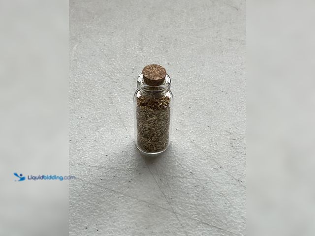Lot 49-5350282 - RARE ONE INCH GLASS VILE OF PURE 24K GOLD FLAKES