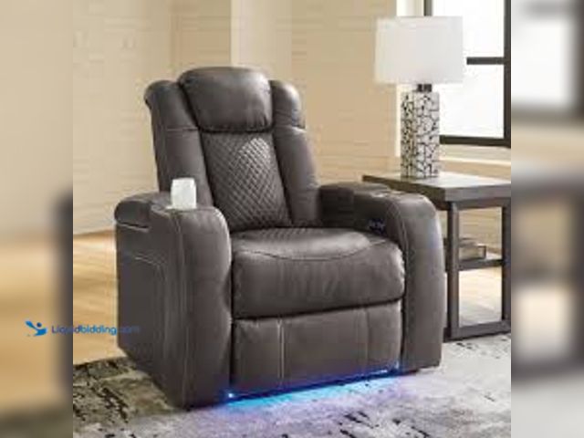 Lot 49-5485606 - Signature DESIGN BY ASHLEY. Fyne-Dyme Black Faux Leather Standard Power Recliner with Adjustable Hea...