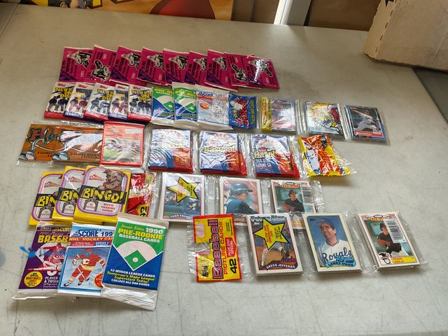 Lot 49-1830535 - COLLECTIBLE TABLE LOT OF VARIOUS SPORT AND NON SPORT WAX PACKS ALL SEALED INCLUDING NEW KIDS ON THE ...