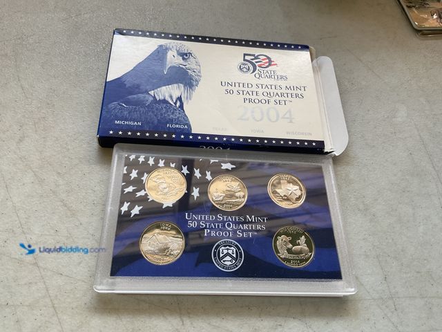Lot 49-3609211 - 2004 UNITED STATES MINT 50 STATE QUARTERS PROOF SET 5 COINSIN HARD PLASTIC CASE AND ORIGINAL SLEEVE