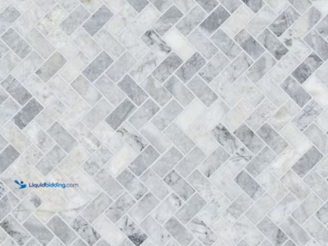 Lot 49-1631134 - APPROX. (9) SQ FT of MSI Capri Blue Herringbone 12 in. x 12 in. x 0.38 in. Honed Marble Mesh-Mounted...