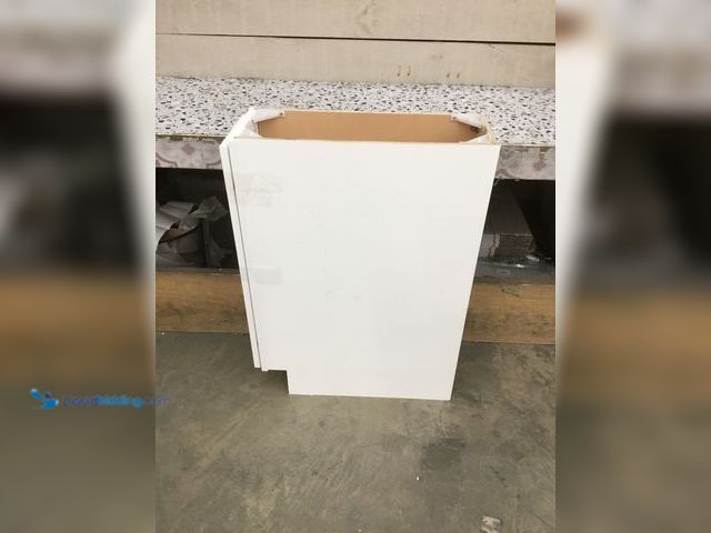 Lot 49-5408573 - White Kitchen Cabinet. Aprox 9" x 24" x 35". Unused. One board is cracked. One screw not included.