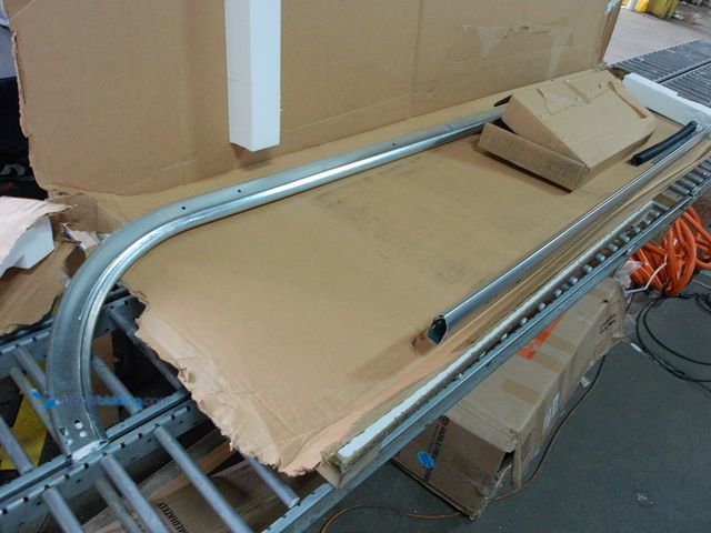 Lot 49-1623804 - Clopay 8x12 radius garage door track with some hardware. Parts and repair.  Ref#PA0710