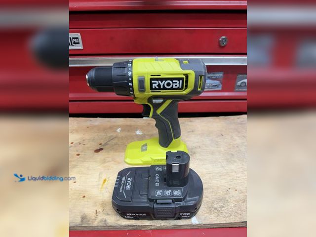 Lot 49-1910257 - Drill , battery and charger.Like new .